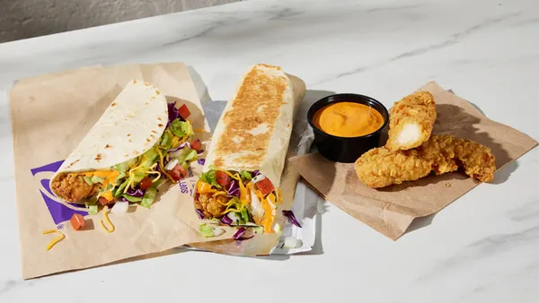 A table with different chicken items from Taco Bell