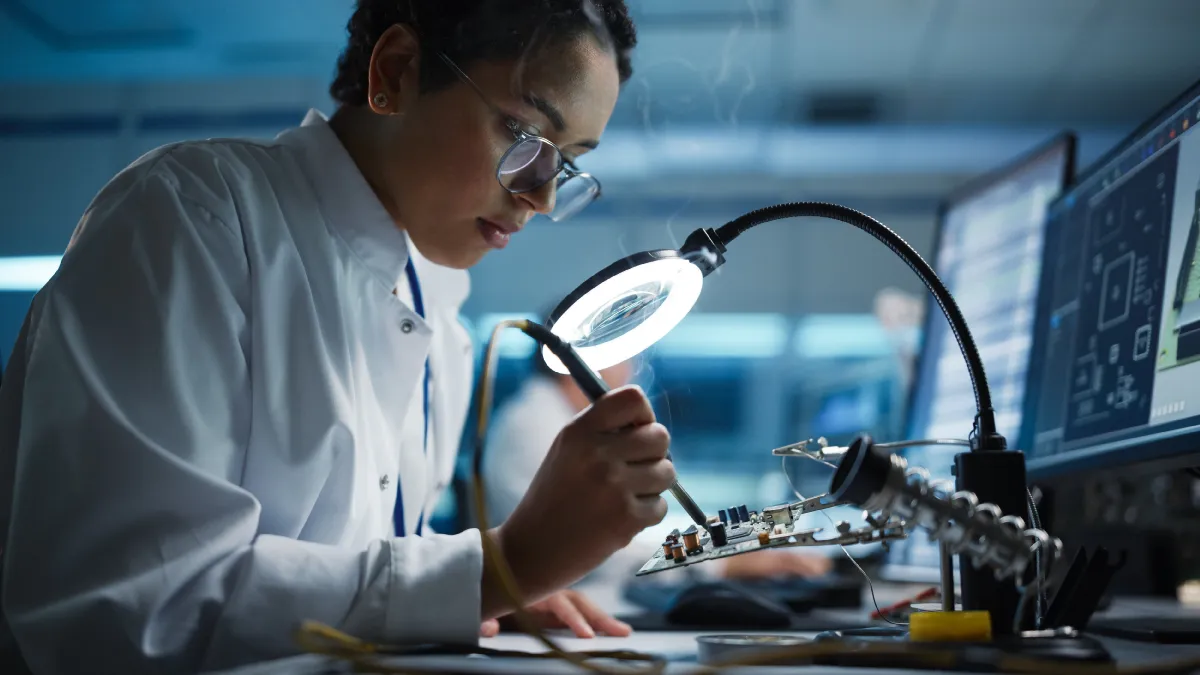 An employee works on a Cisco product.