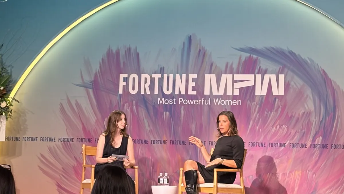 Corie Barry from Best Buy sitting next to a moderator at the Fortune MPW 2025 summit.