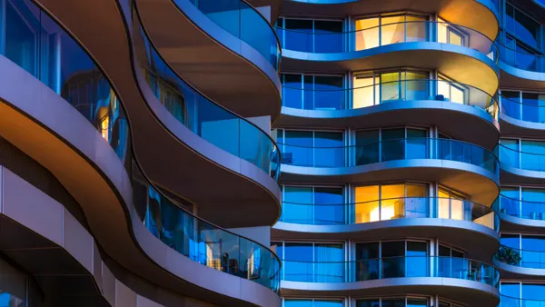 Building facade with illuminated windows at night