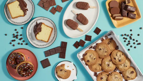 Various baked goods are pictured dipped in Cargill and Voyage Foods' new cocoa-free chocolate alternative.