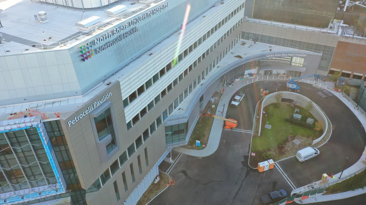 An aerial view of a hospital tower where construction is almost complete.