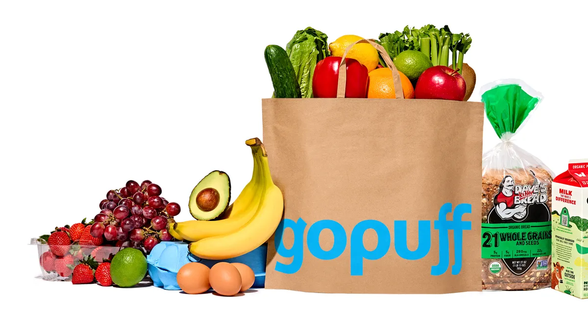 Gopuff brown grocery bag surrounded by fresh produce