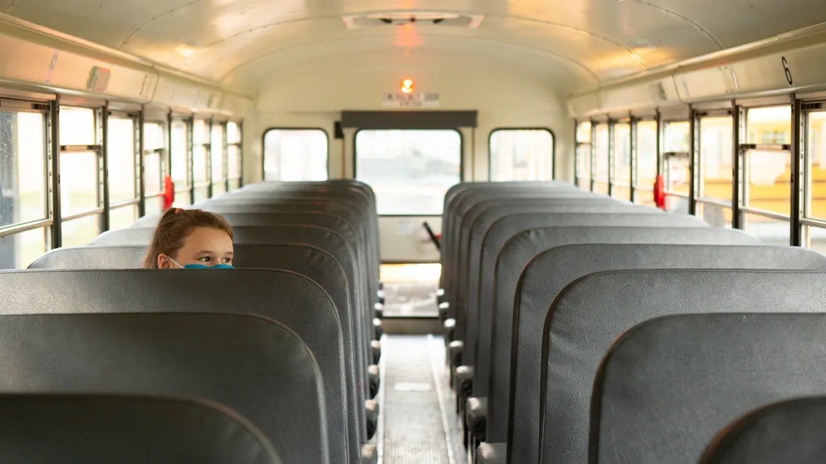 student riding bus alone