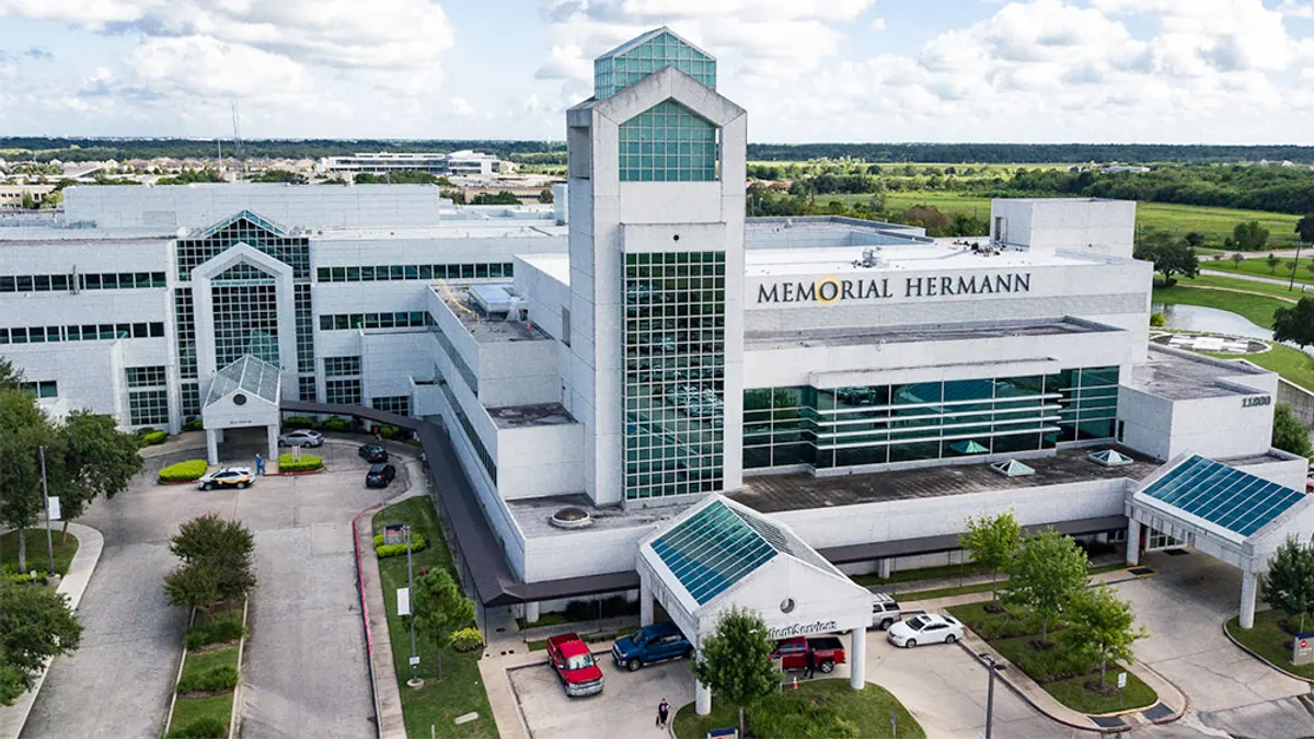 A sprawling hospital with "Memorial Hermann" on its facade.