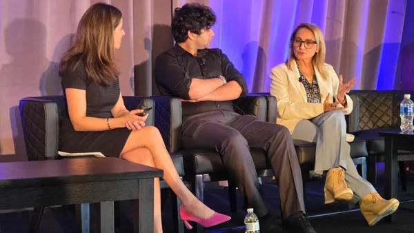 three panelists in business attire