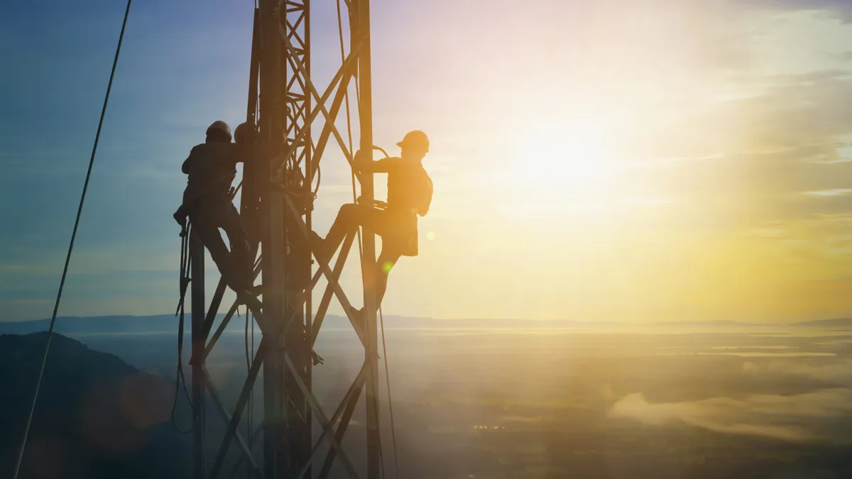 Workers building a high-voltage transmission line.