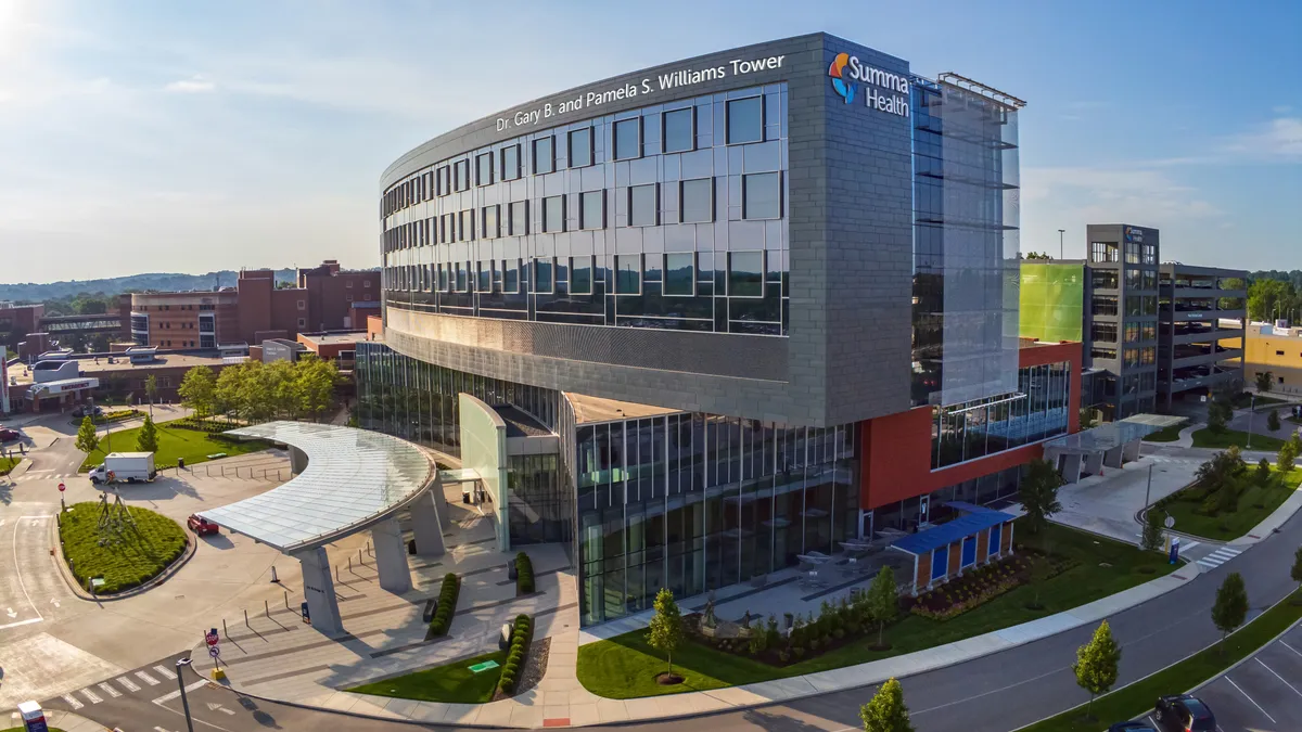 Exterior view of Summa Health's hospital in Akron, that says "Dr. Gary B. and Pamela S. Williams Tower" on the front.