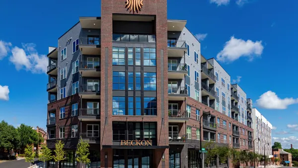 Brick, six-story apartment complex.