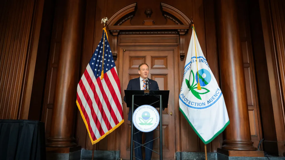 EPA Administrator Lee Zeldin stands at a podium, next to U.S. and EPA flags