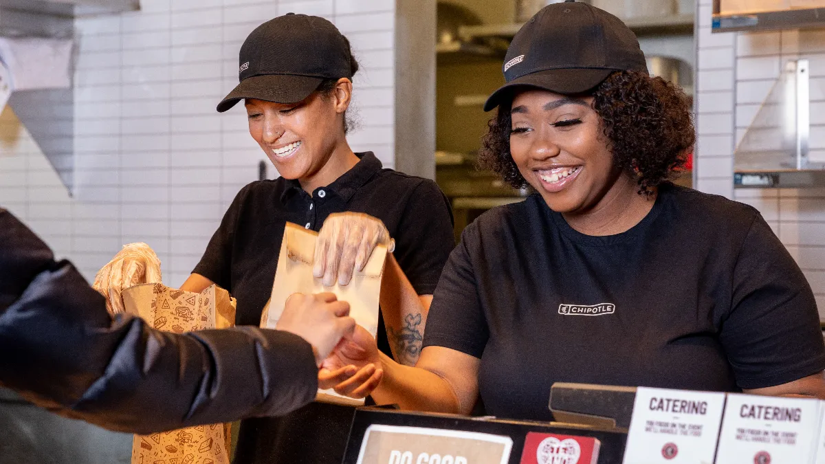 A woman and man at a cash register