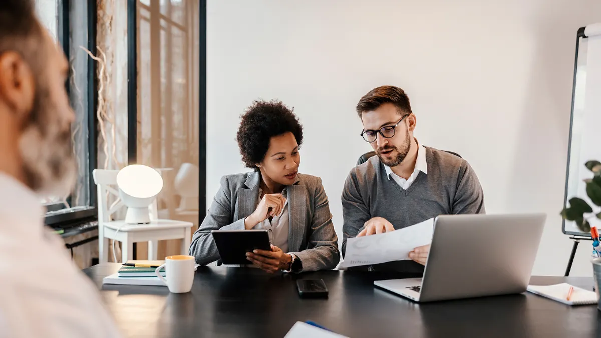 A business discussion with people looking at their devices