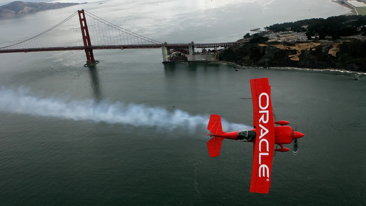 Stunt pilot Sean Tucker flies his Team Oracle biplane near the Golden Gate Bridge as he practices for the 2006 San Francisco fleet week October 5, 2006 in San Francisco.