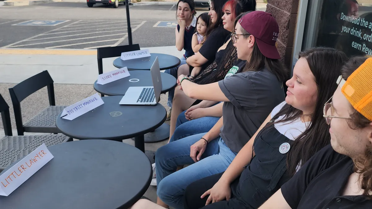 Unionized Starbucks workers outside of cafe