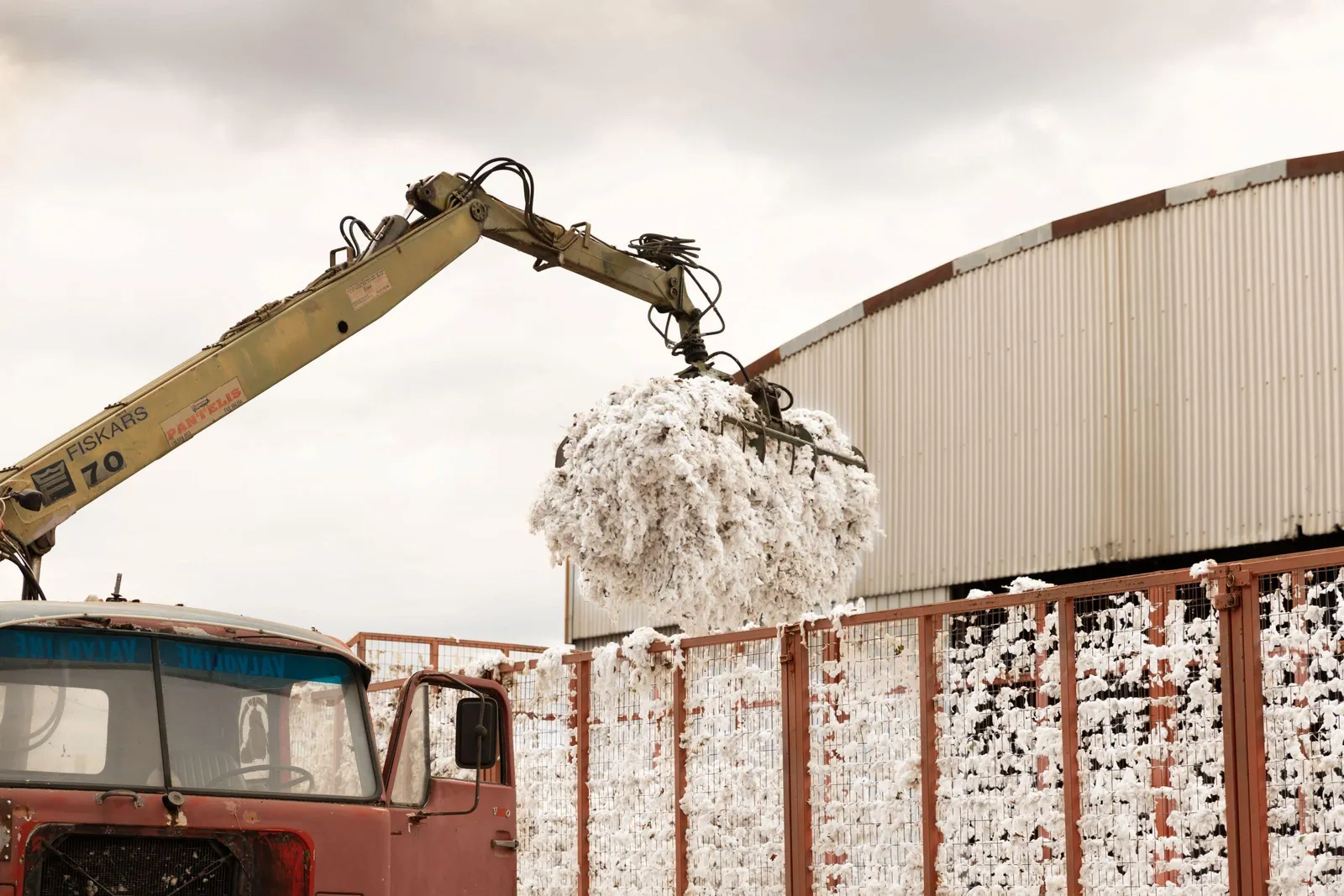 Crane moving raw cotton