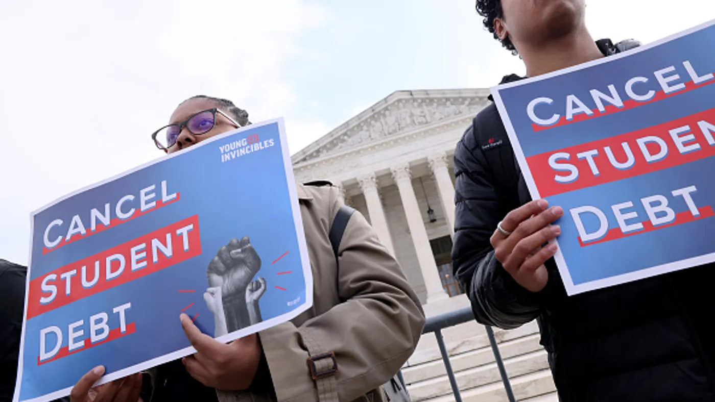 Student loan borrowers and advocates gather for a rally.