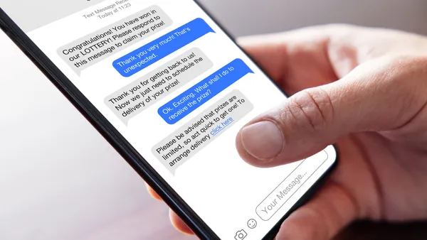 A close-up shot shows a person holding a phone displaying text messages exchanged with a scammer about claiming a fake prize.