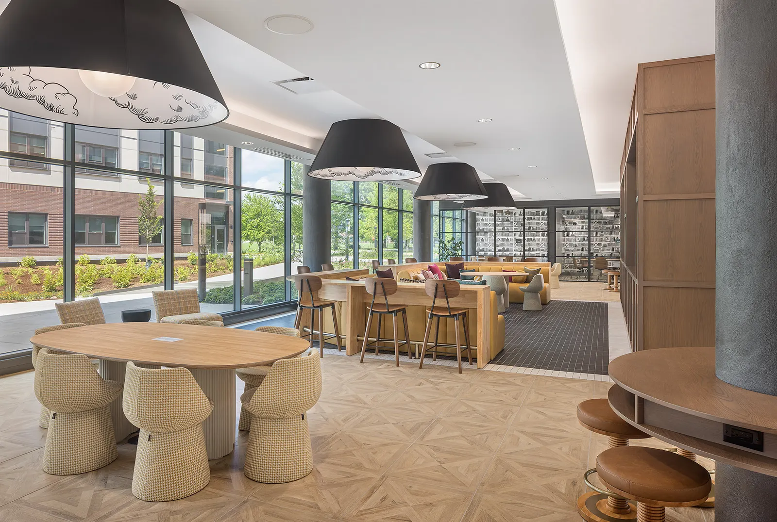 A room with multiple long tables and chairs.