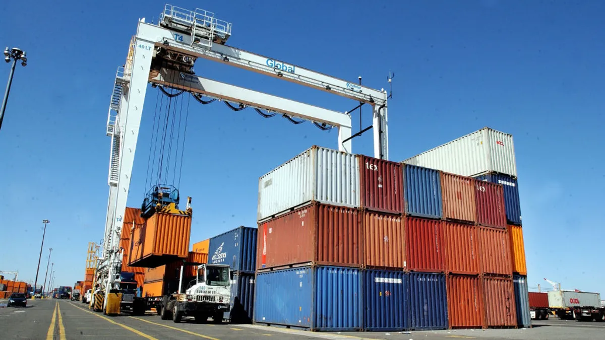 A tractor trailer has it's shipping container lifted for storage and examination at the docks March 22, 2004 in Jersey City, New Jersey.