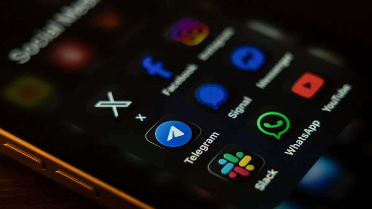 A smartphone screen displays several messaging apps