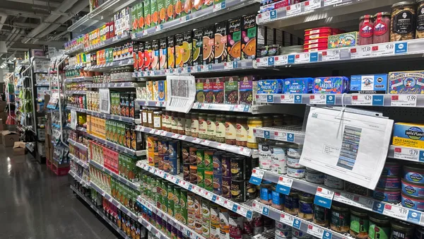 Line of canned goods at grocery store