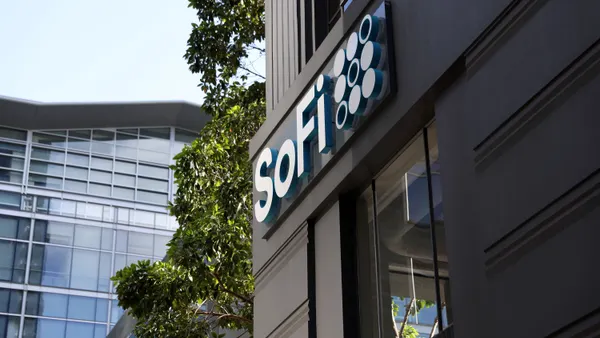 A close-up of the side of an office building shows the "SoFi" name and logo.