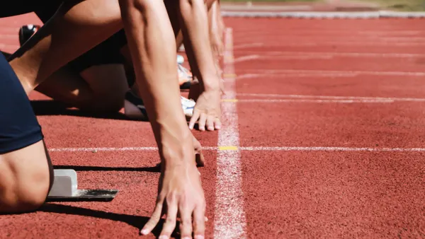 Faceless shot of runners at the start of a race
