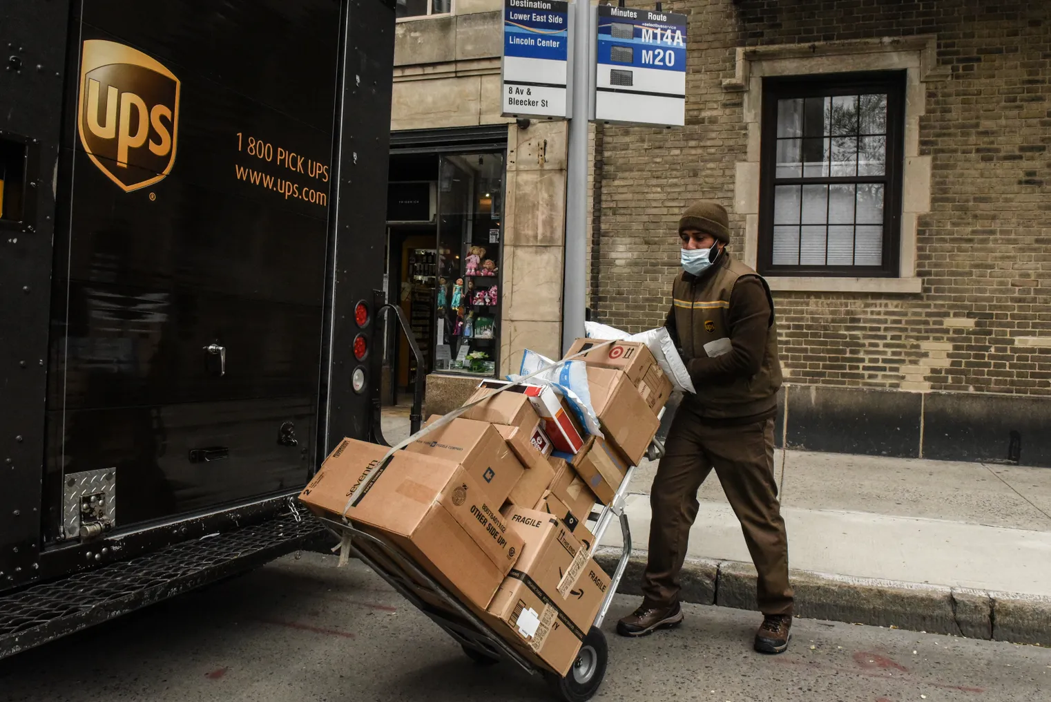 A United Parcel Service worker delivers packages on April 29, 2020 in New York City.