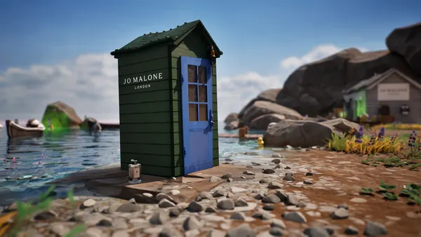 A green shack with a blue door on a beach in the video game Fortnite. Jo Malone London is printed in white on the side of the shack.