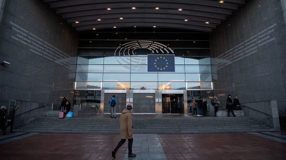 A person walks past the European Parliament building in Brussels, Belgium.