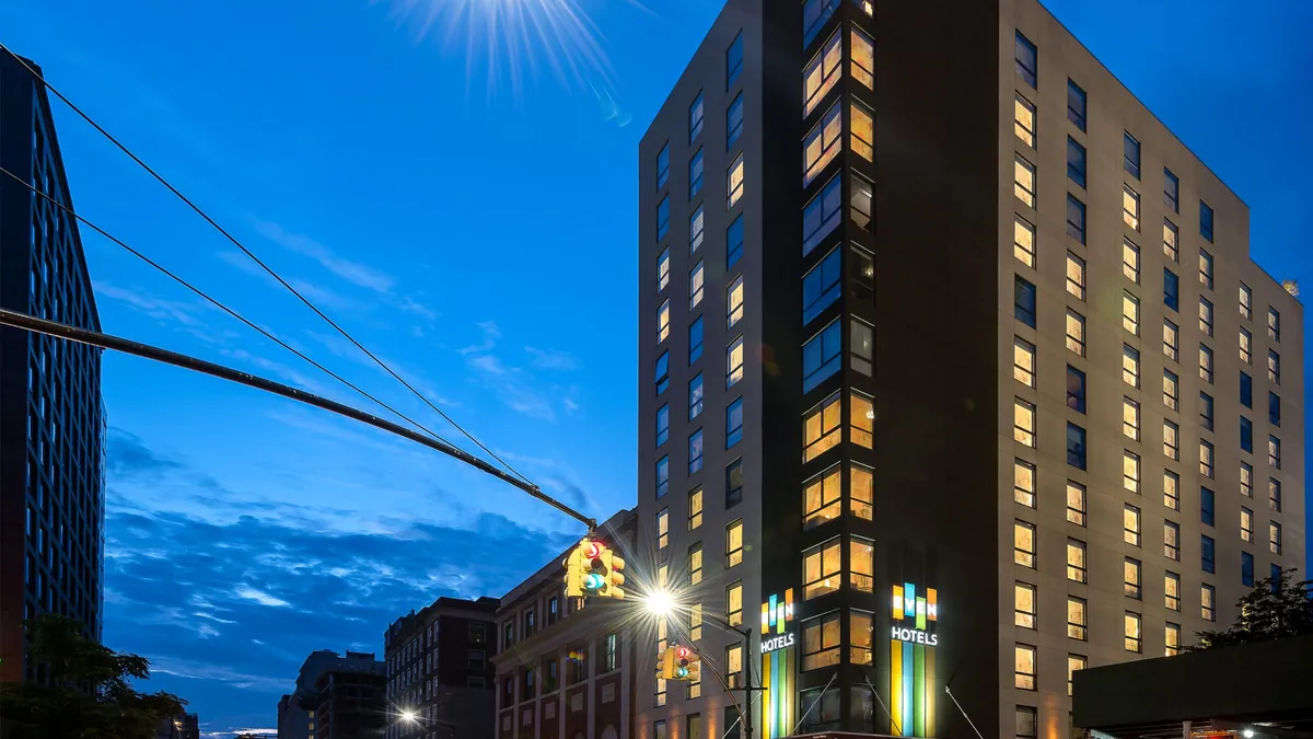 An exterior shot of Even Hotel Brooklyn, now management by HEI Hotels & Resorts.