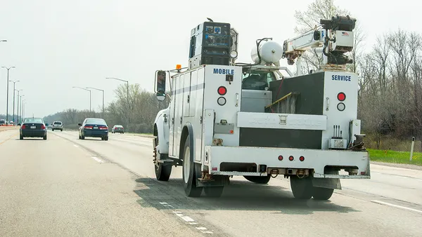 A utility truck on the road.