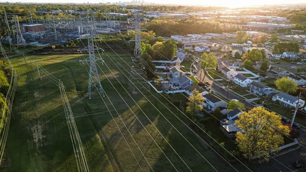 Drone view of a neighborhood in South Jersey through electrical wires