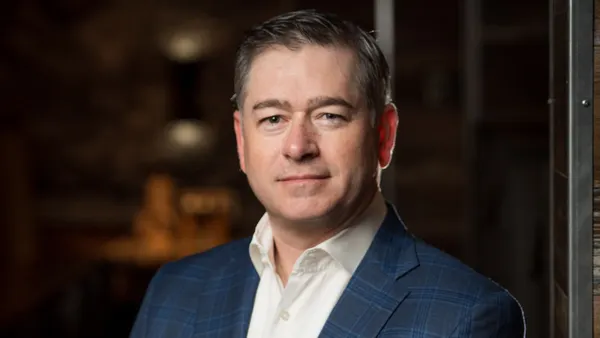 An image of person wearing a blue suit.