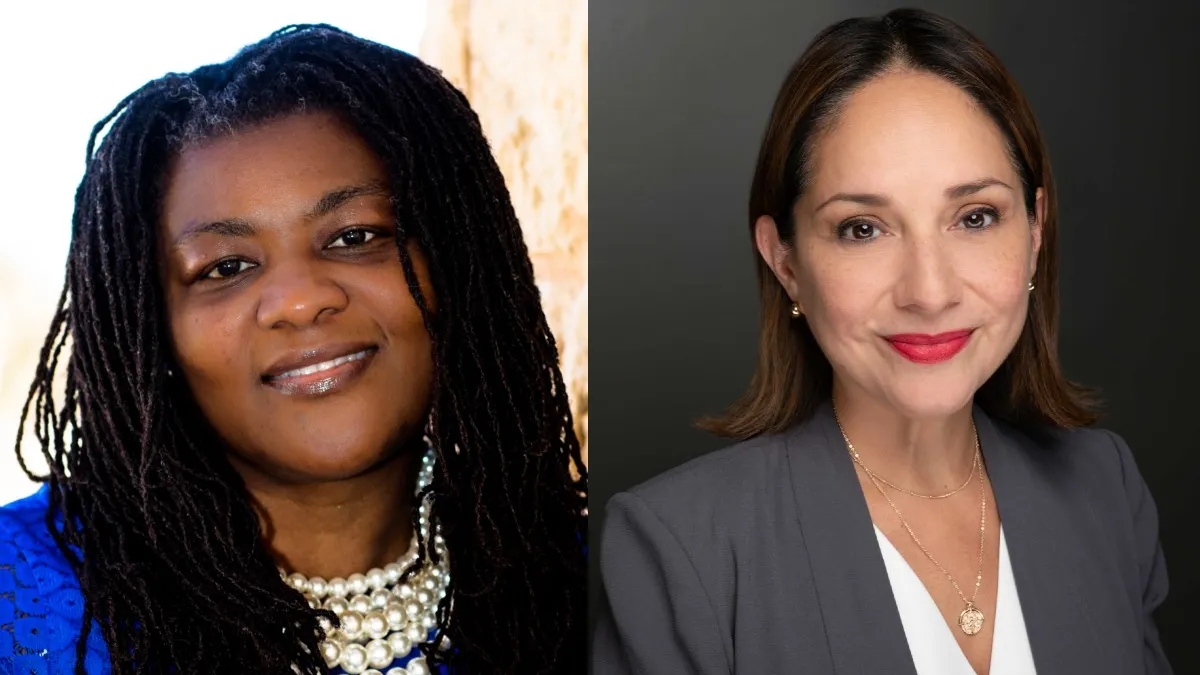 An image of a woman wearing pearls and a blue shirt and another woman wearing a gray suit.