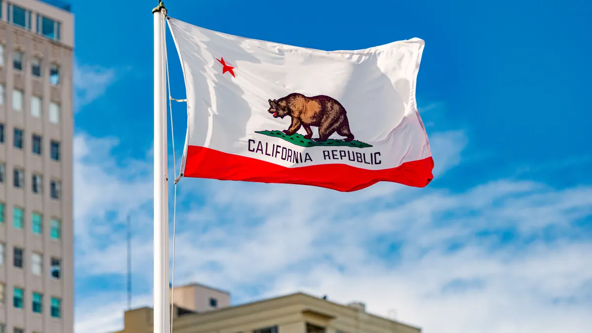 A view of the California state flag, which has an image of the bear and the words "California Republic."