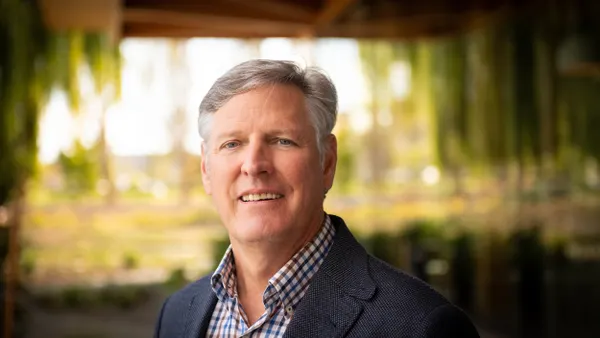 A headshot of Johnston Erwin, CEO of TRex Bio.