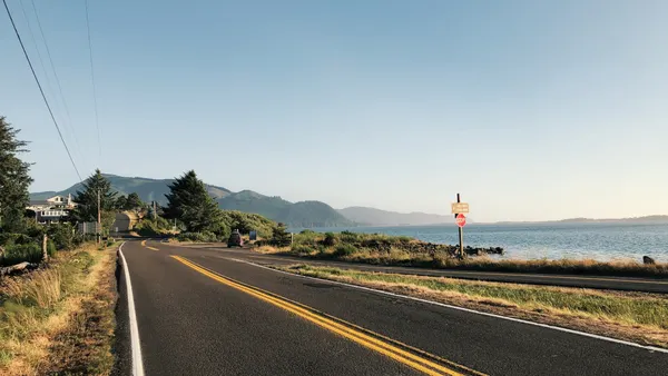 A quiet and empty highway next to the shoreline of the Pacific coast near Tillamook, Oregon.