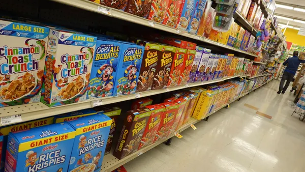 Boxes of sugary cereal in a store.