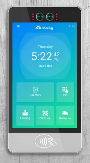 A touchscreen with multiple green buttons reading &quot;Directory&quot;, &quot;PIN&quot;, &quot;Leasing&quot; and &quot;Deliveries&quot;, all on a white wall.