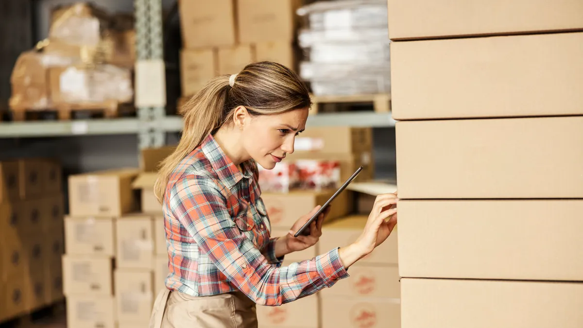 A factory worker controlling shipment