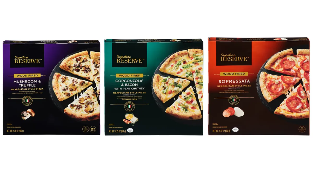 Three boxes of frozen pizzas.