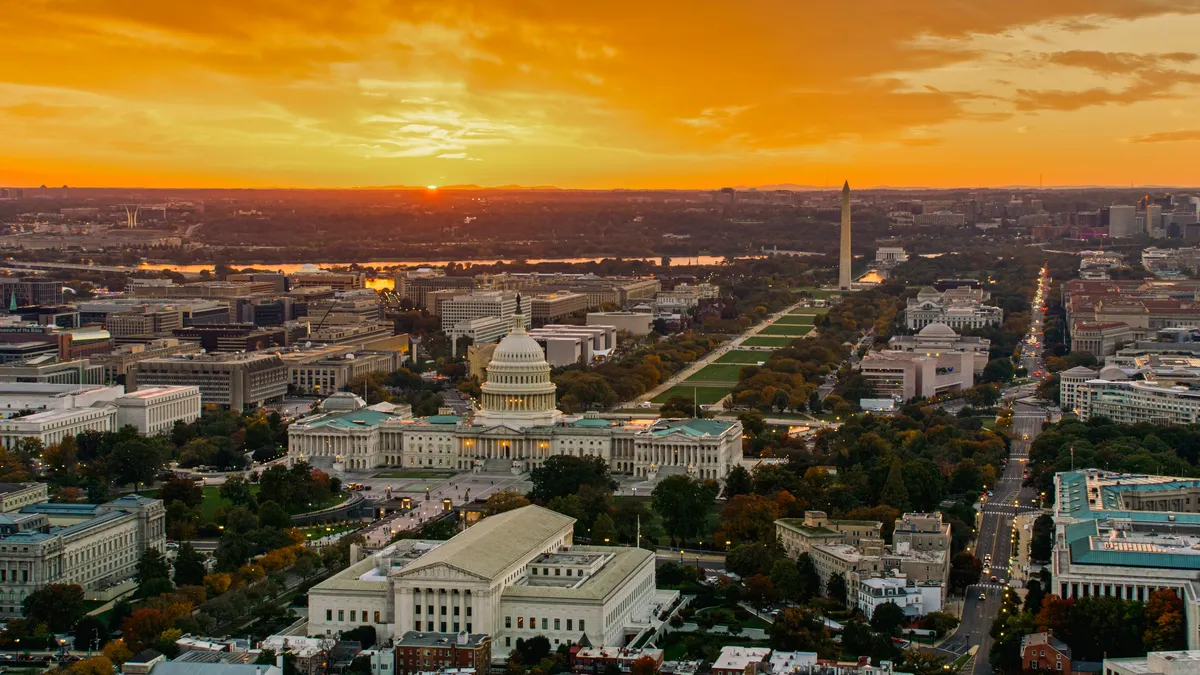 An aerial view of the National Mall in Washington, D.C. In the foreground is the U.S. Supreme Court building. Also seen in the photo is the U.S. Capitol and Washington Monument.