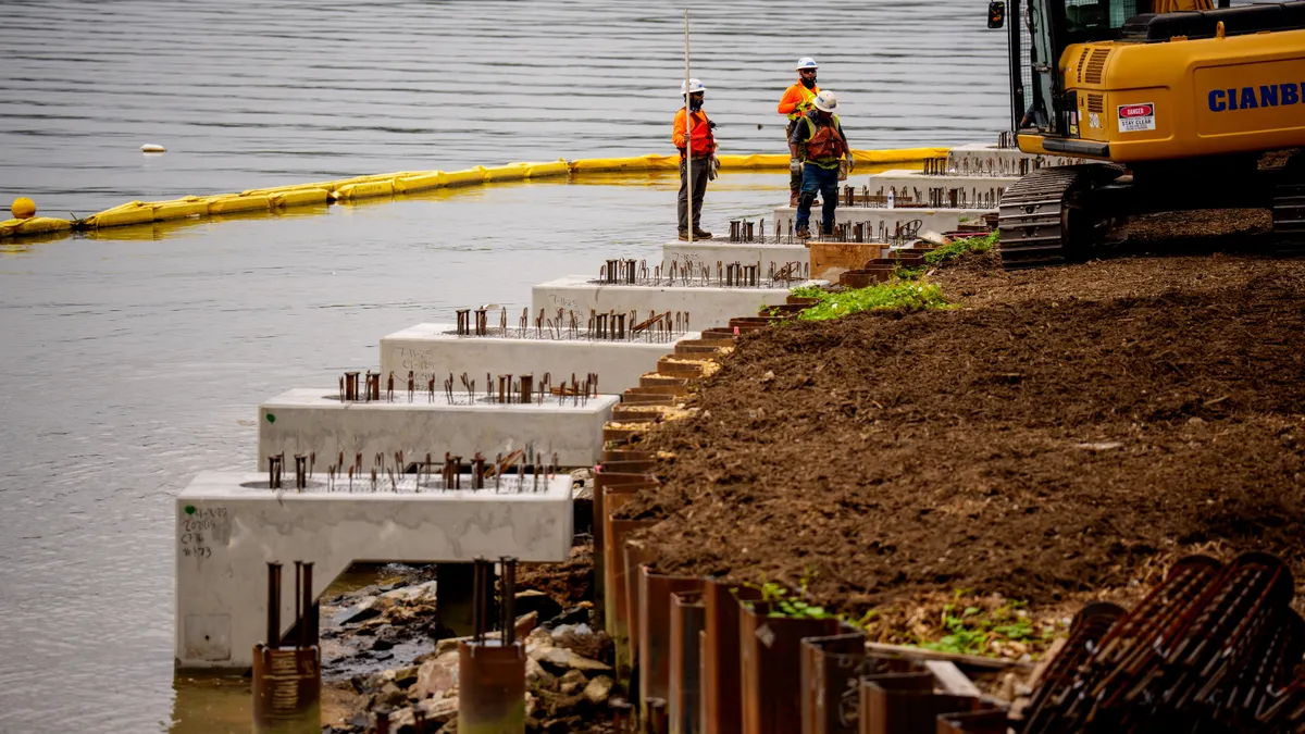 Laborers work on an upgraded river all at the Tidal Basin along the Potomac River