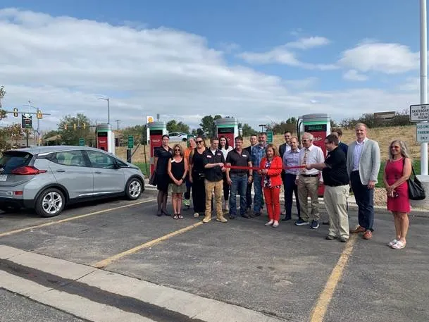 A photo of Kum & Go officials and staff at the unveiling of EV charging machines in Colorado in August 2021.