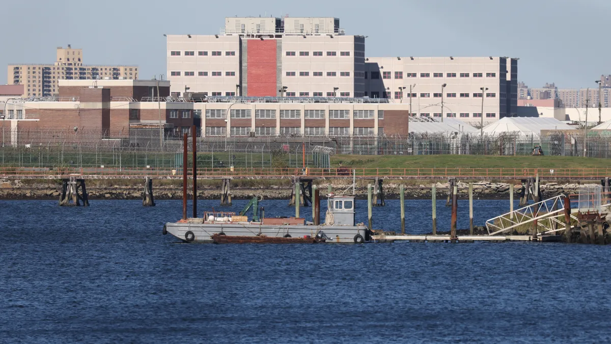 A photo shows New York City's Rikers Island in the distance