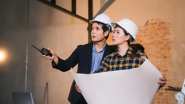 Contractors discuss a potential bid.