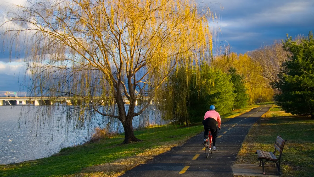 Cyclist on a bike path by the Potomac River in Washington, D.C.