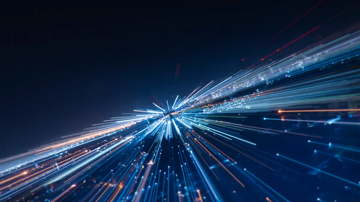 multiple blue and orange lines that start at a depth beyond us and come toward, growing larger and expanding outward