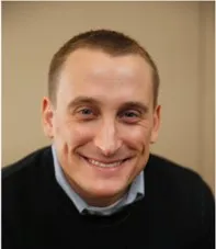 A head and shoulders photo of Brian Zimmerman, chief people officer for TA.